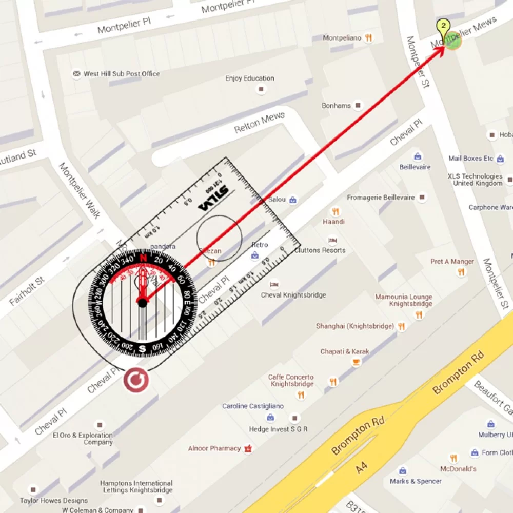 Feng Shui compass and crystal on a house floor plan